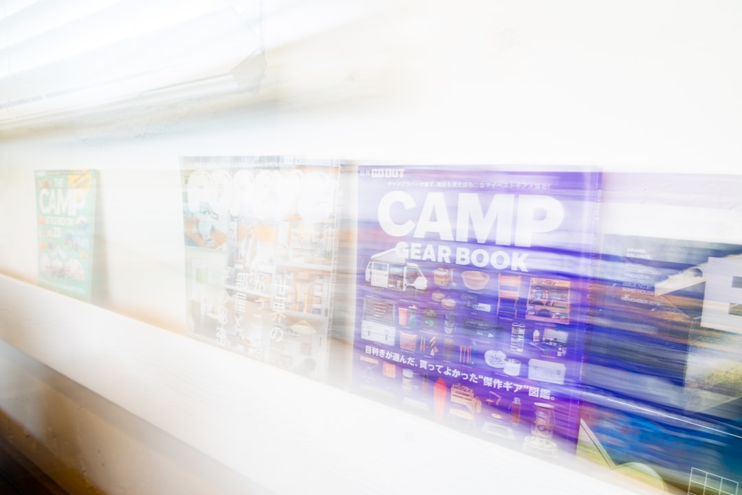 Books are blurred on a shelf.