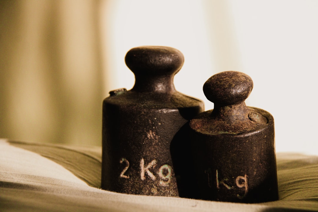 a couple of vases sit on top of a book