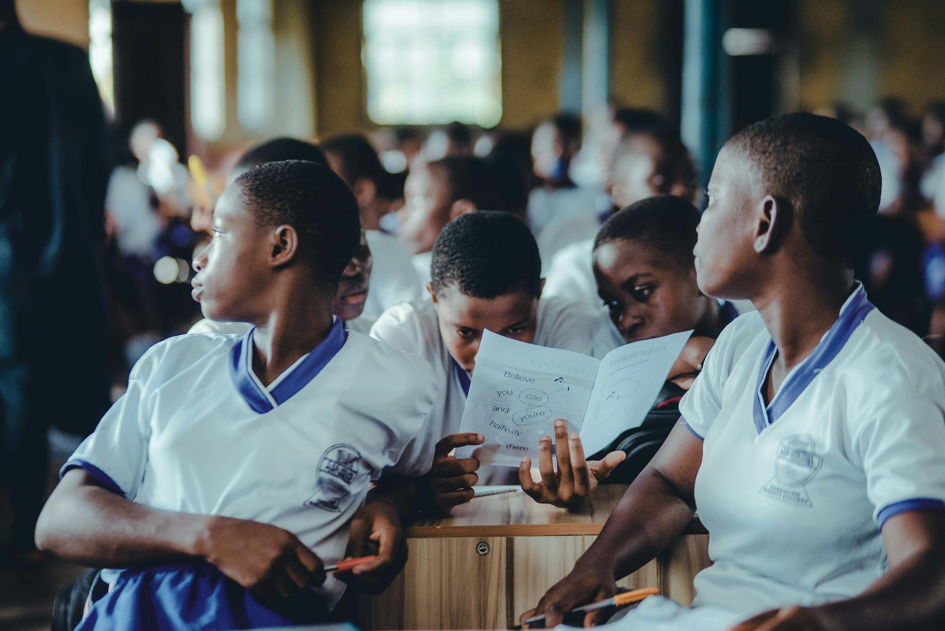 African students in a classroom collaborate on a learning assignment.