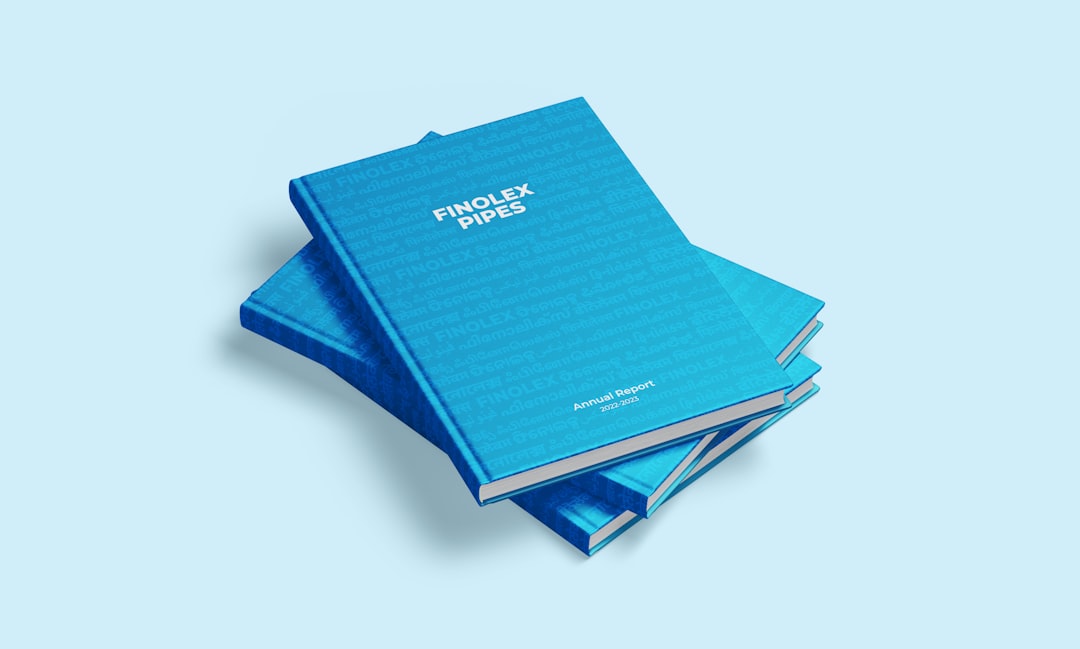 a stack of blue folders sitting on top of each other